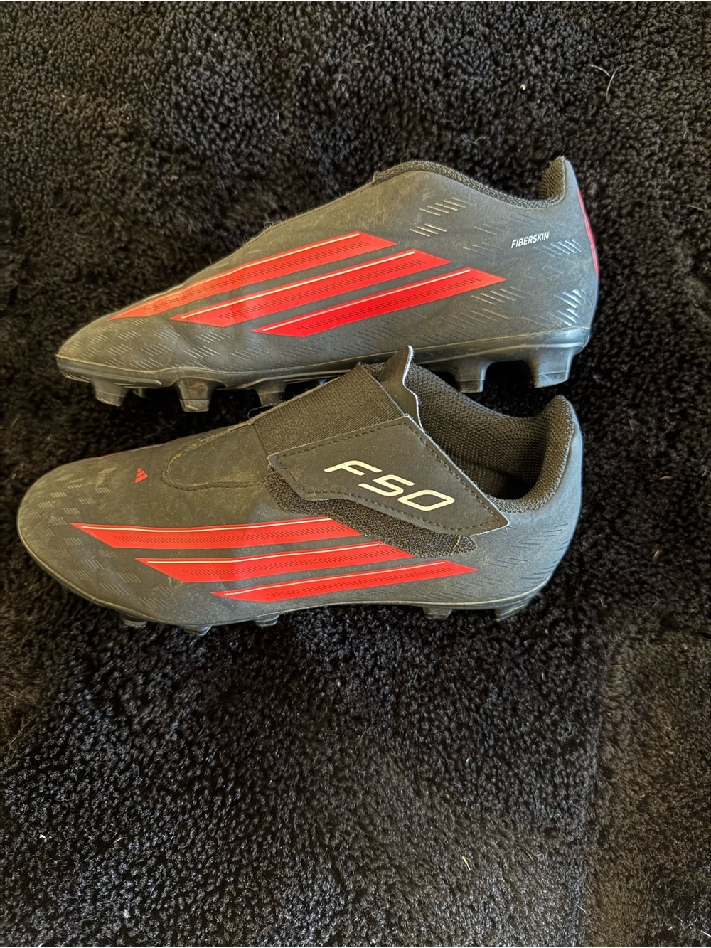 adidas F50 Soccer Cleats in Black with Red Stripes
